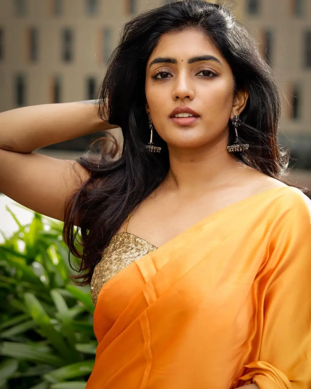 Eesha Rebba Charming Stills In Orange Saree Sleeveless Blouse